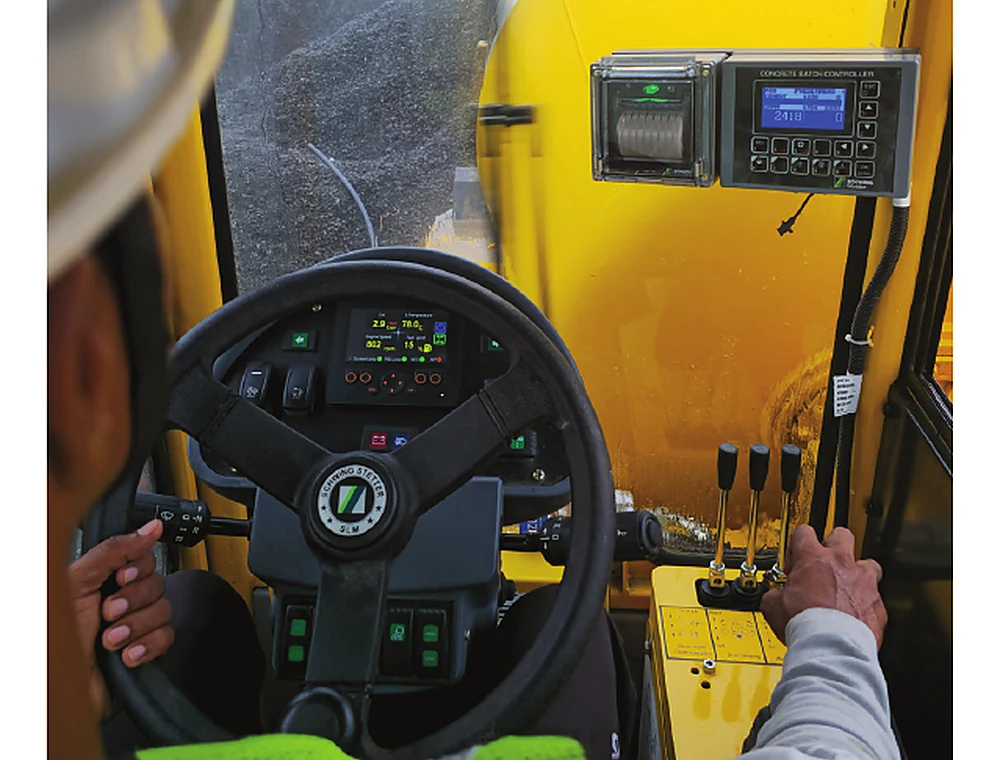 Digital dashboard and operator controls inside a SCHWING self-loading mixer